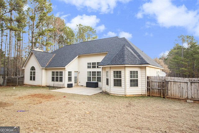 rear view of house with a patio