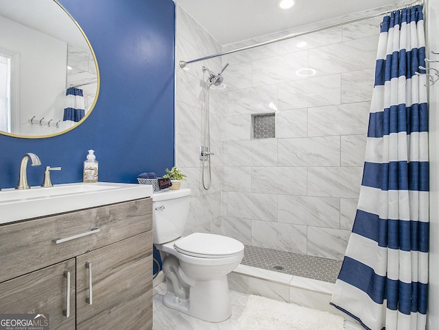 bathroom featuring a shower with curtain, vanity, and toilet