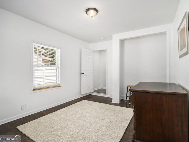 bedroom featuring dark hardwood / wood-style floors