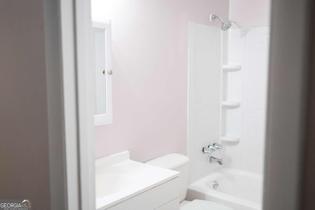 full bathroom featuring vanity, shower / bathtub combination, and toilet