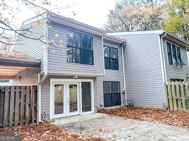 rear view of property with a patio area and french doors