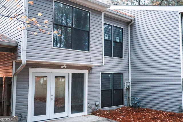 back of property featuring french doors