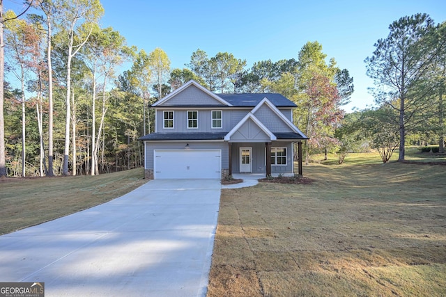 craftsman inspired home featuring a garage, driveway, a front lawn, and board and batten siding