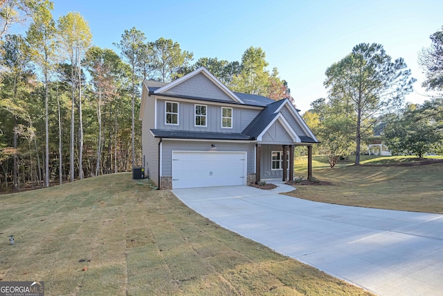 view of front facade with board and batten siding, a garage, stone siding, driveway, and a front lawn