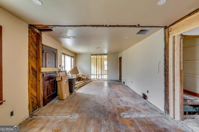 unfurnished living room featuring wood-type flooring