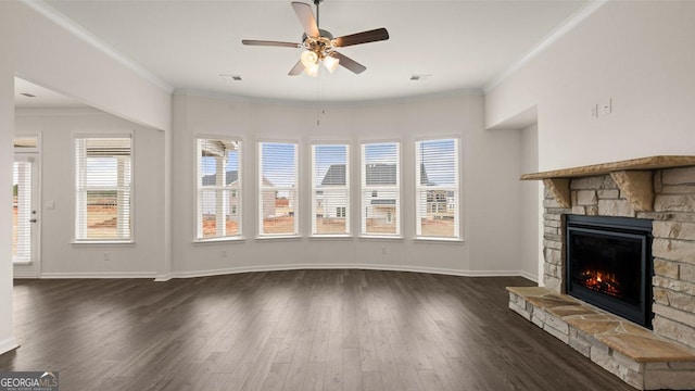 unfurnished living room featuring a fireplace, ornamental molding, ceiling fan, and dark wood-type flooring