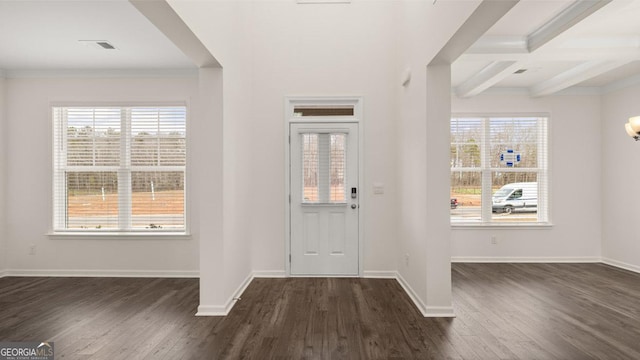 entrance foyer featuring beam ceiling, a wealth of natural light, dark wood-type flooring, and coffered ceiling