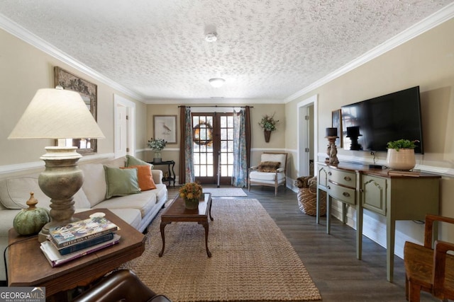 living room featuring a textured ceiling, dark hardwood / wood-style floors, crown molding, and french doors