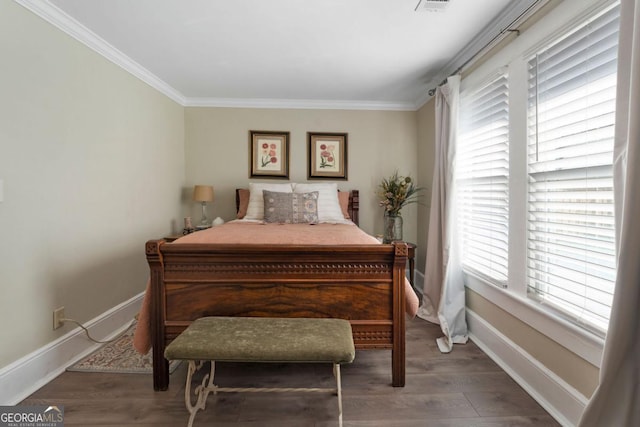 bedroom with crown molding and dark wood-type flooring