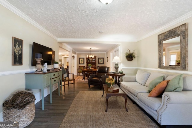 living room with dark hardwood / wood-style floors and ornamental molding