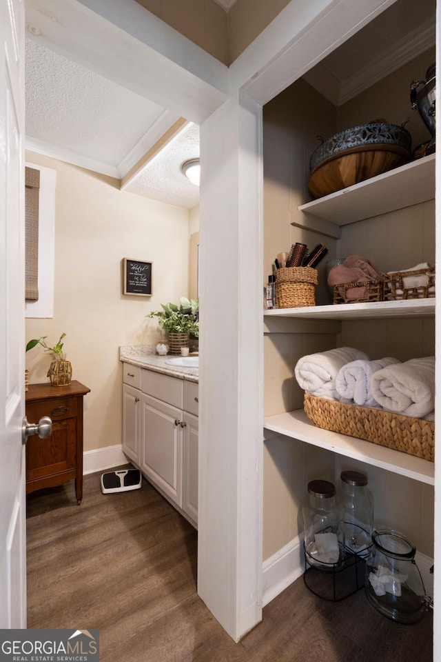 interior space featuring a textured ceiling and dark hardwood / wood-style floors