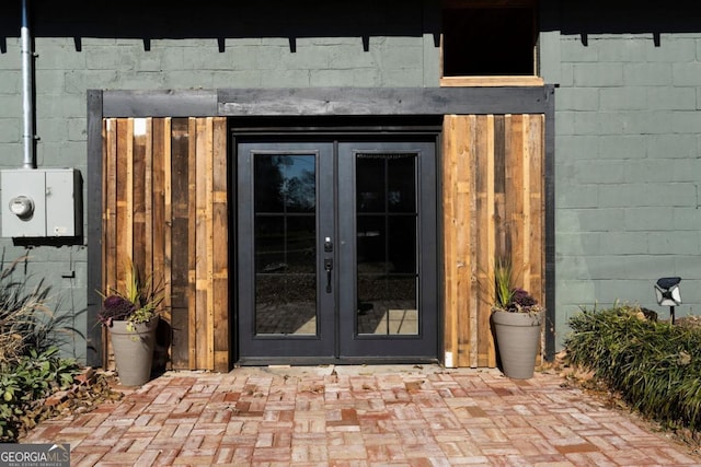 property entrance featuring french doors