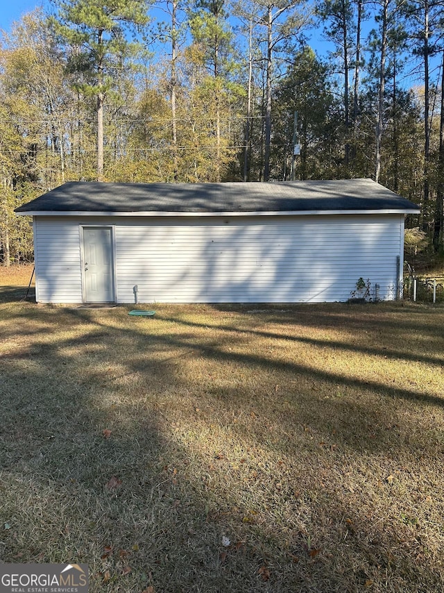 garage featuring a yard