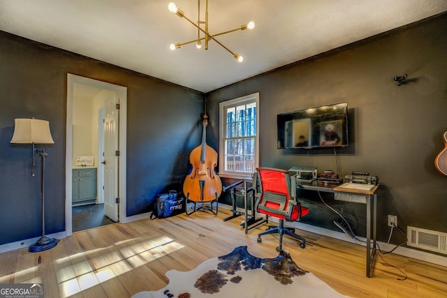 office featuring hardwood / wood-style floors and a notable chandelier