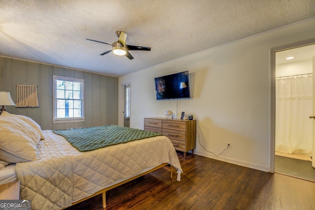 bedroom with dark hardwood / wood-style floors, connected bathroom, a textured ceiling, and ceiling fan