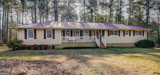 single story home featuring covered porch and a front lawn