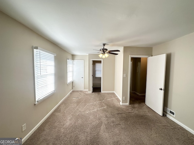 unfurnished bedroom with carpet floors and ceiling fan