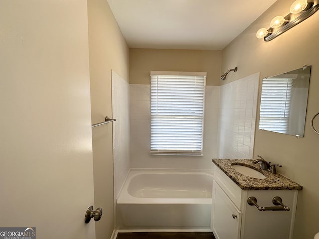 bathroom with vanity and washtub / shower combination