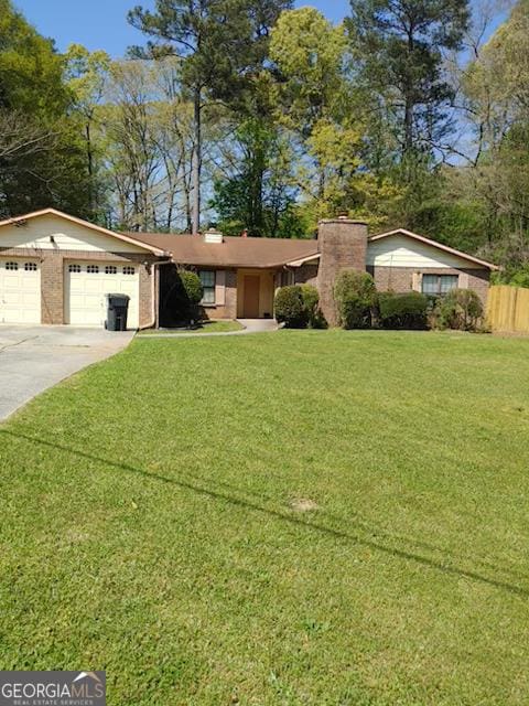 ranch-style home with a garage and a front yard