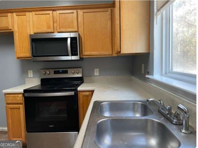 kitchen featuring sink and appliances with stainless steel finishes