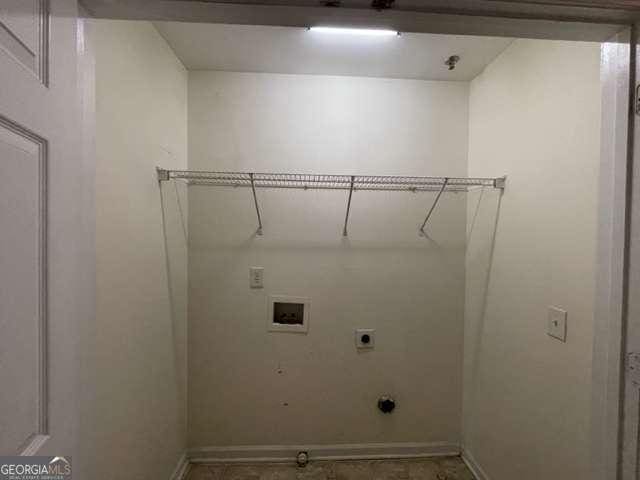 washroom featuring electric dryer hookup and washer hookup