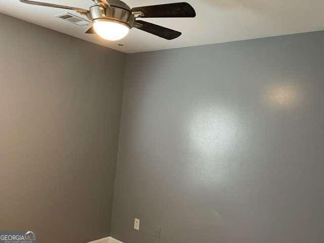 spare room featuring ceiling fan