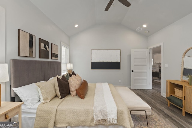 bedroom featuring dark hardwood / wood-style flooring, ceiling fan, and lofted ceiling