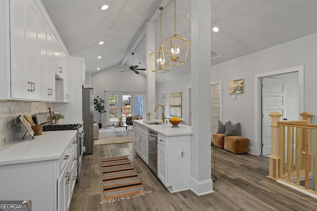 kitchen with sink, vaulted ceiling with beams, dark hardwood / wood-style floors, white cabinets, and appliances with stainless steel finishes