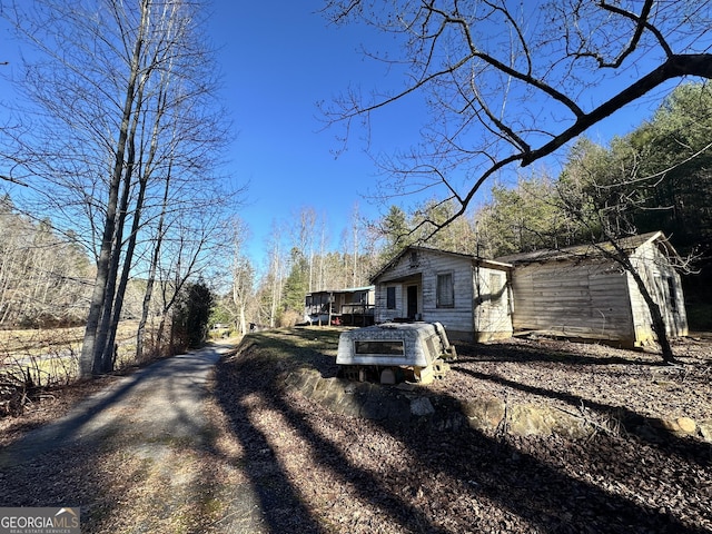 view of side of home with a deck