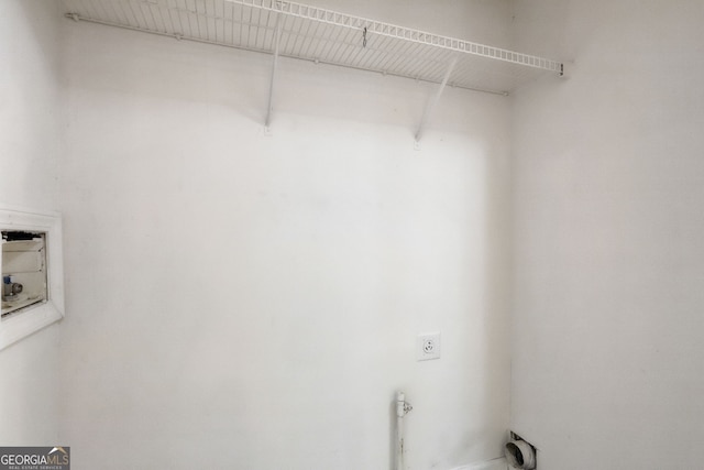 washroom with hookup for an electric dryer and hookup for a washing machine