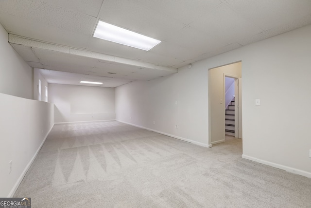 unfurnished room with light carpet