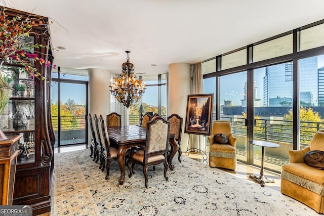 750 Park Ave NE Unit 8E, Atlanta, GA 30326 - dining area featuring a chandelier, wood finished floors, and a wall of windows