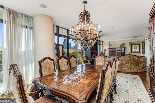 750 Park Ave NE Unit 8E, Atlanta, GA 30326 - dining room with a chandelier, healthy amount of natural light, wood finished floors, and ornamental molding