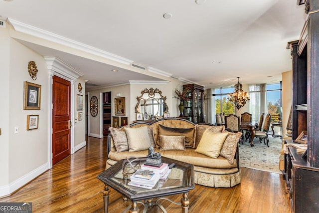 living room featuring crown molding, expansive windows, dark hardwood / wood-style floors, and an inviting chandelier