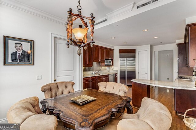 750 Park Ave NE Unit 8E, Atlanta, GA 30326 - dining room with recessed lighting and crown molding
