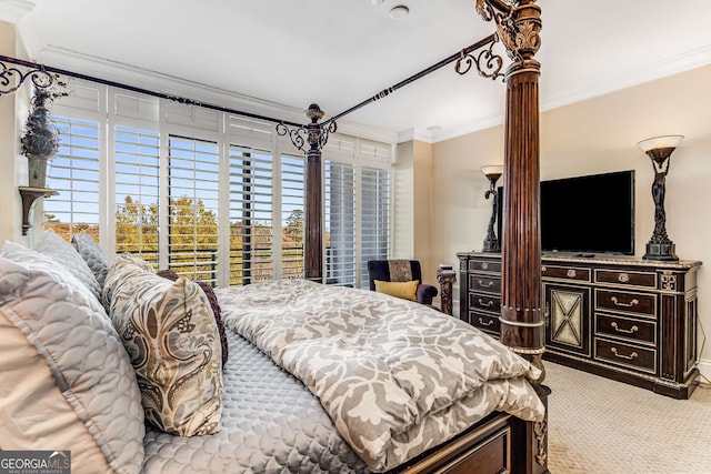 750 Park Ave NE Unit 8E, Atlanta, GA 30326 - bedroom featuring ornamental molding, multiple windows, and carpet flooring