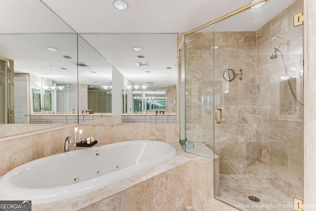 750 Park Ave NE Unit 8E, Atlanta, GA 30326 - bathroom featuring a shower stall and a whirlpool tub