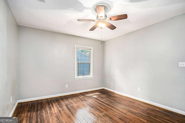 unfurnished room featuring ceiling fan and dark hardwood / wood-style floors