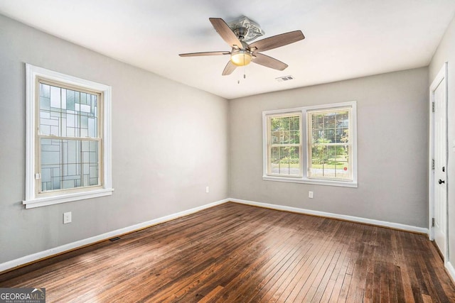 unfurnished room featuring ceiling fan and dark hardwood / wood-style floors