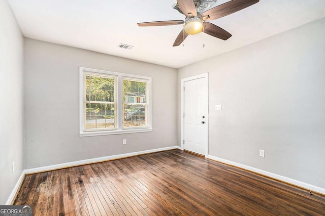 unfurnished room featuring dark hardwood / wood-style floors and ceiling fan