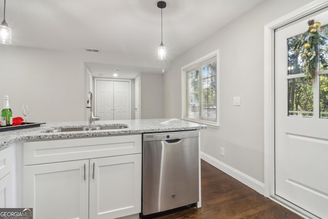 kitchen featuring dishwasher, white cabinetry, hanging light fixtures, and sink