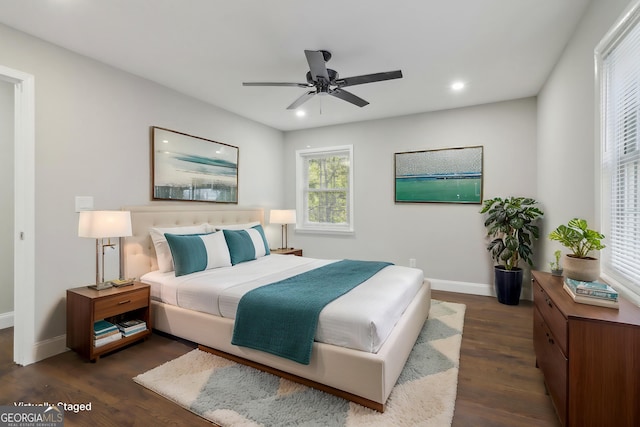 bedroom featuring dark hardwood / wood-style floors and ceiling fan