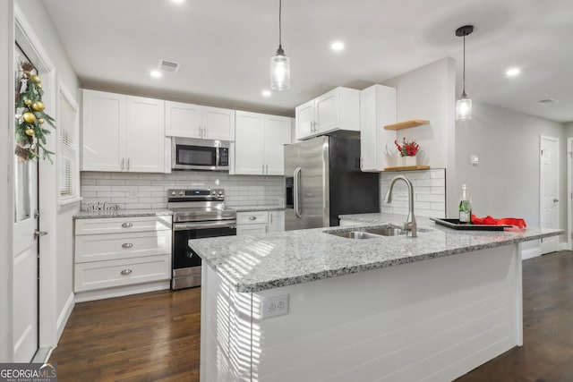 kitchen featuring white cabinetry, sink, stainless steel appliances, dark hardwood / wood-style floors, and kitchen peninsula