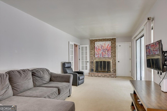 living room with light colored carpet and a brick fireplace