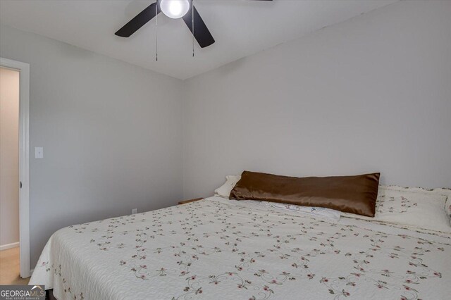 bedroom with ceiling fan and carpet floors