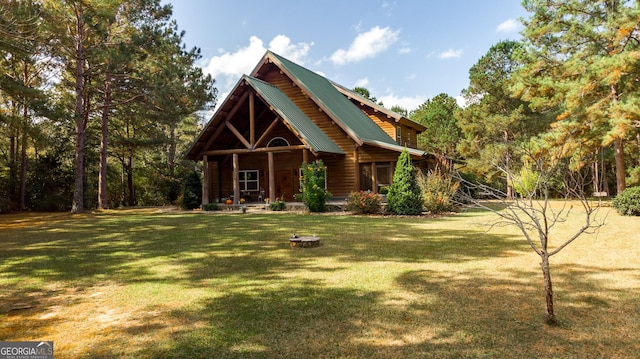 log cabin featuring a front yard