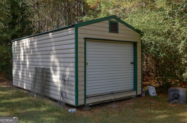 view of outbuilding with a garage