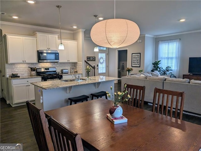 dining room featuring crown molding and dark wood-type flooring