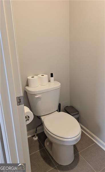 bathroom with tile patterned floors and toilet