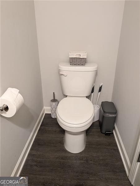 bathroom featuring hardwood / wood-style flooring and toilet